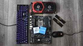 Several PC components and peripherals laid out, including a motherboard, mouse, keyboard and RAM.